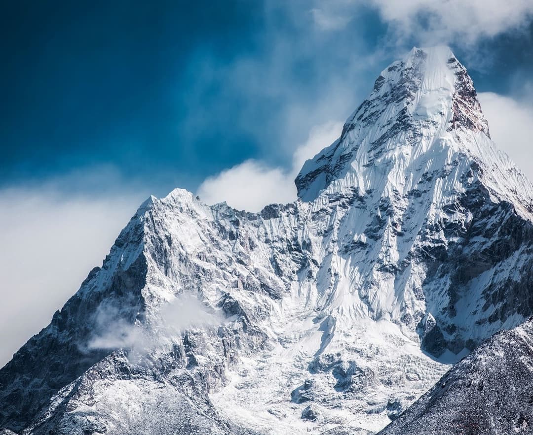 Golden Sunrise over Snow capped Mountain