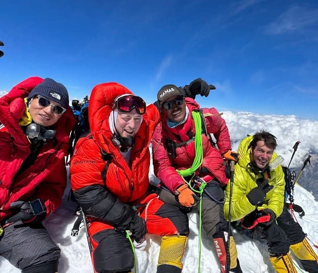 Climbers on top of mountain