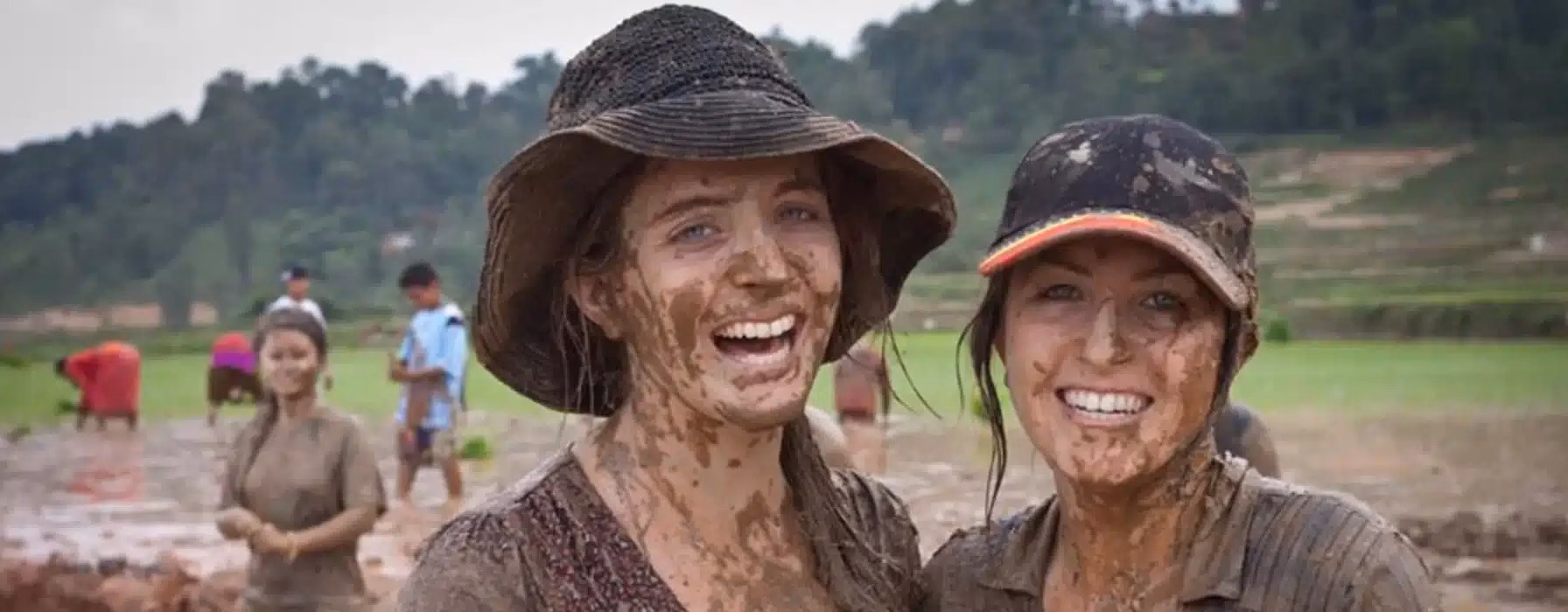 Trekkers enjoying the lively Mud festival in Nepal