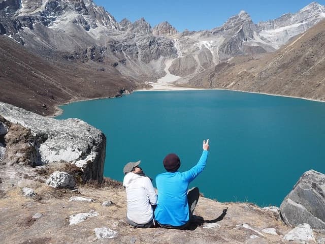 Two visitors enjoying view of Gokyo Lake