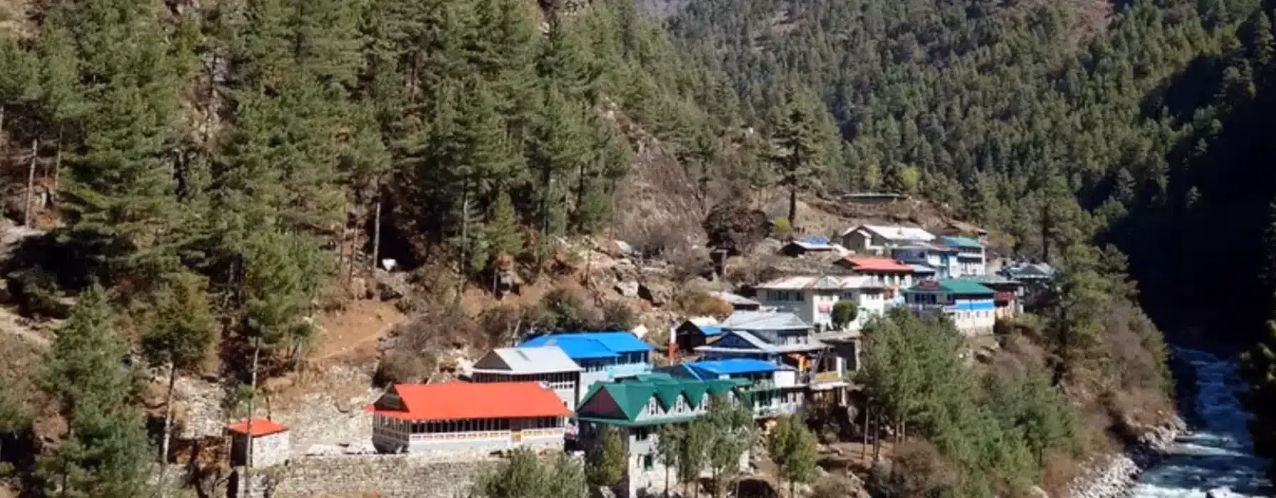 A scenic view of the colorful buildings of Jorsale village nestled in the mountain valley