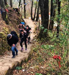 travellers hiking towards chisapani