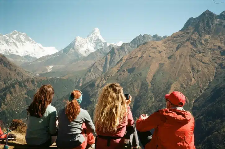 Four trekkers overlooking Mount Amadabalm in Khumbu